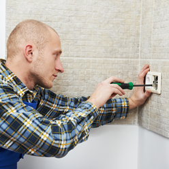 Electrician Installing Wall Outlets