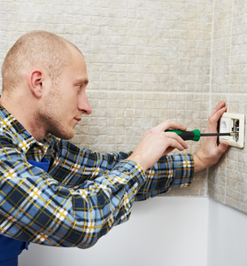 Electrician Installing Wall Outlets