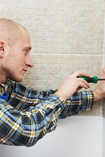 Electrician Installing Wall Outlets