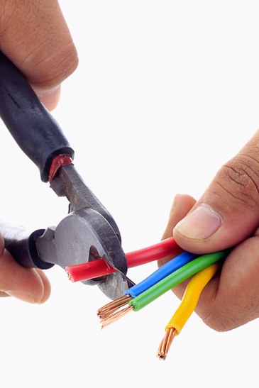 Electrician Working On Cabling Lighting