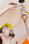 Electrician Working On Cabling Lighting