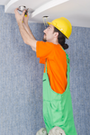 Electrician Working On Cabling Lighting