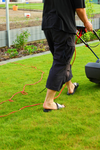 Man Mowing The Lawn