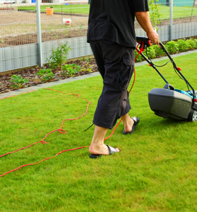Man Mowing The Lawn