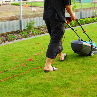 Man Mowing The Lawn