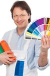 Painter With Paints And Sample Cards